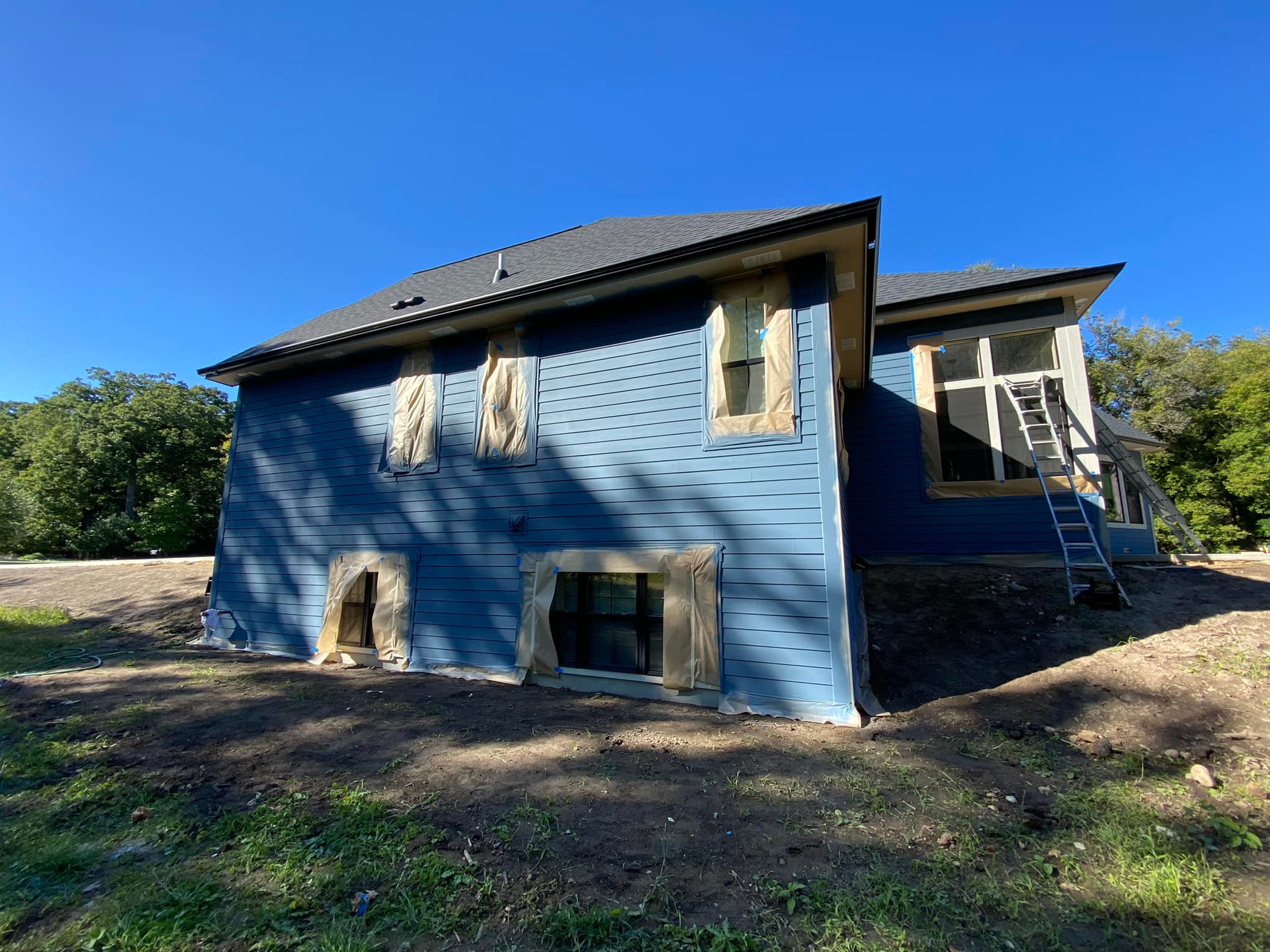 residential home blue exterior painting